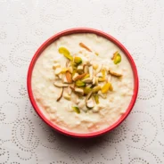sweet-rabdi-lachha-rabri-basundi-made-with-pure-milk-garnished-with-dry-fruits-served-bowl-moody-bac (1)